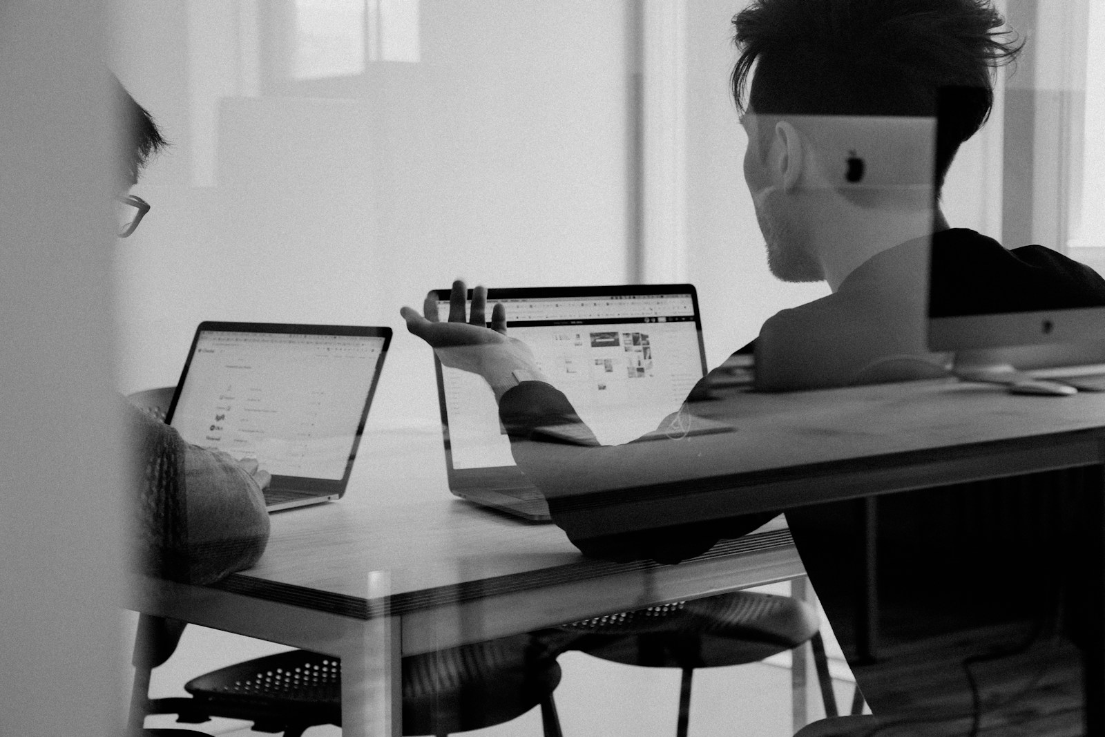 A professional reviewing documents at their desk